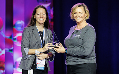 2022 Innovation Award winner Emma Chory, Ph.D. receiving her award from SLAS CEO Vicki Loise