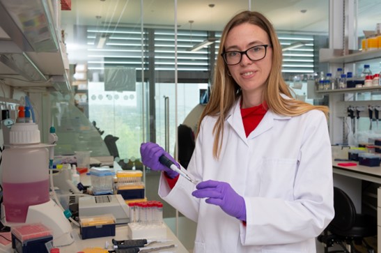 Madeline Lancaster, Ph.D. in a lab setting.